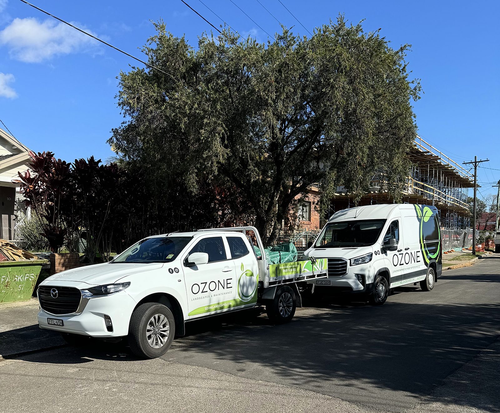 Ozone Landscapes & Maintenance branded ute and van on site